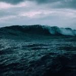 wave rolling turbulent sea, beneath