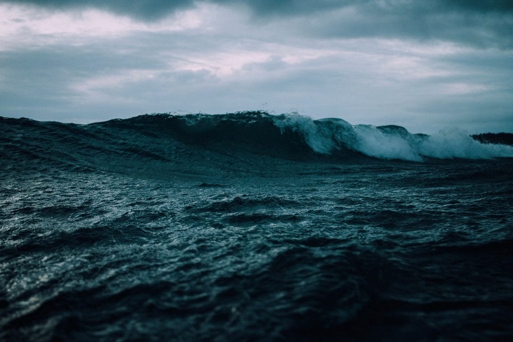wave rolling turbulent sea, beneath
